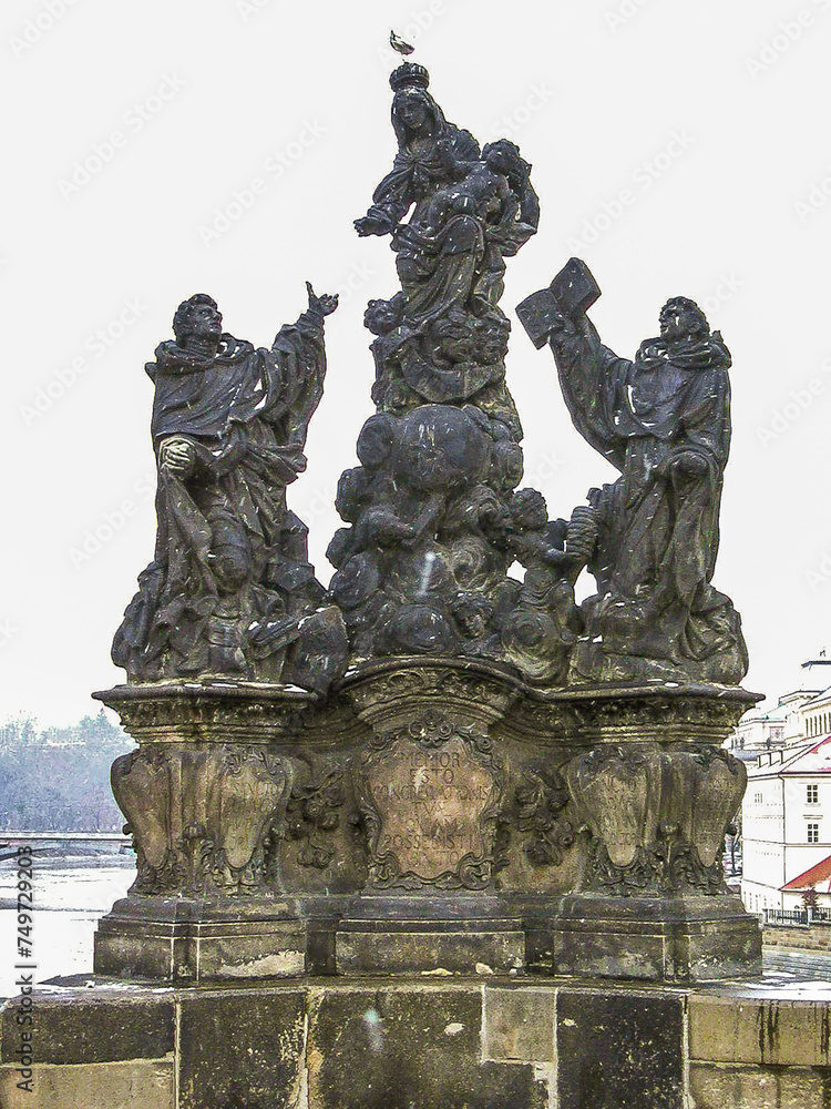 Well preserved statues of Madonna, Saint Dominic and Thomas Aquinas on the Charles Bridge in old town of Prague the capital of the Czech Republic