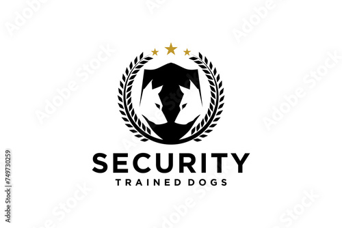Guard dog training logo, with laurel wreath ornament and silhouette of two dog heads.