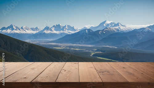 Empty wooden tabletop with mountains background for advertising and presentation