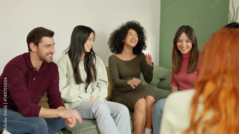 Diverse group of people laughing sitting on the sofa Diverse group of people laughing sitting on the sofa