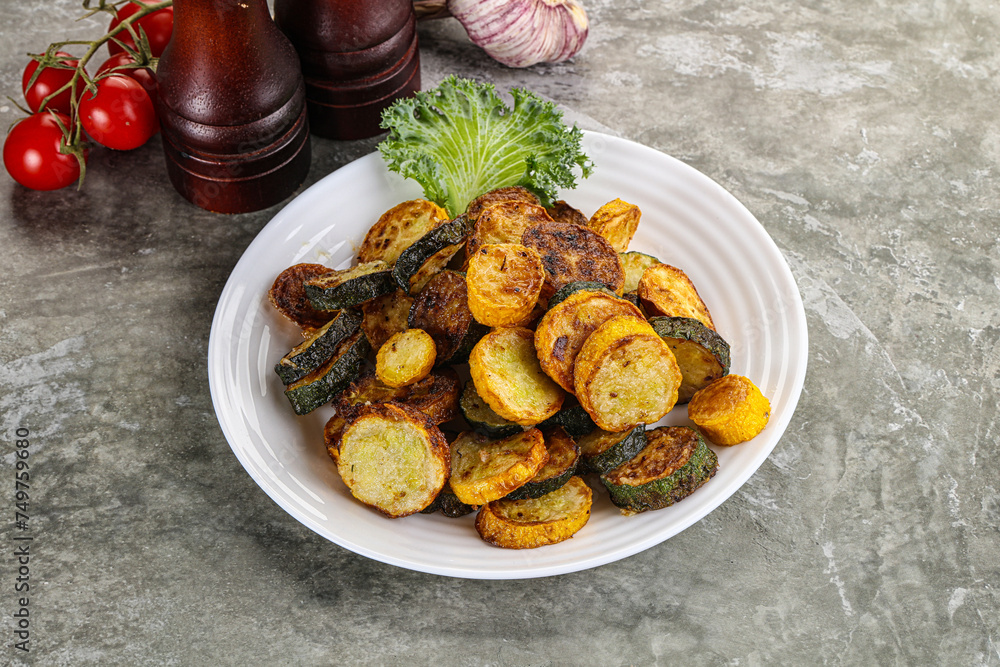 Roasted young zucchini in the plate Roasted young zucchini in the plate