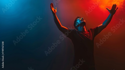 Obraz na płótnie A Christian man praying to God crying and emotional with his arms raised w salonie