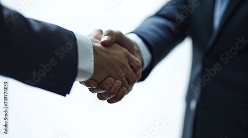 A firm handshake between professionals seals the deal.