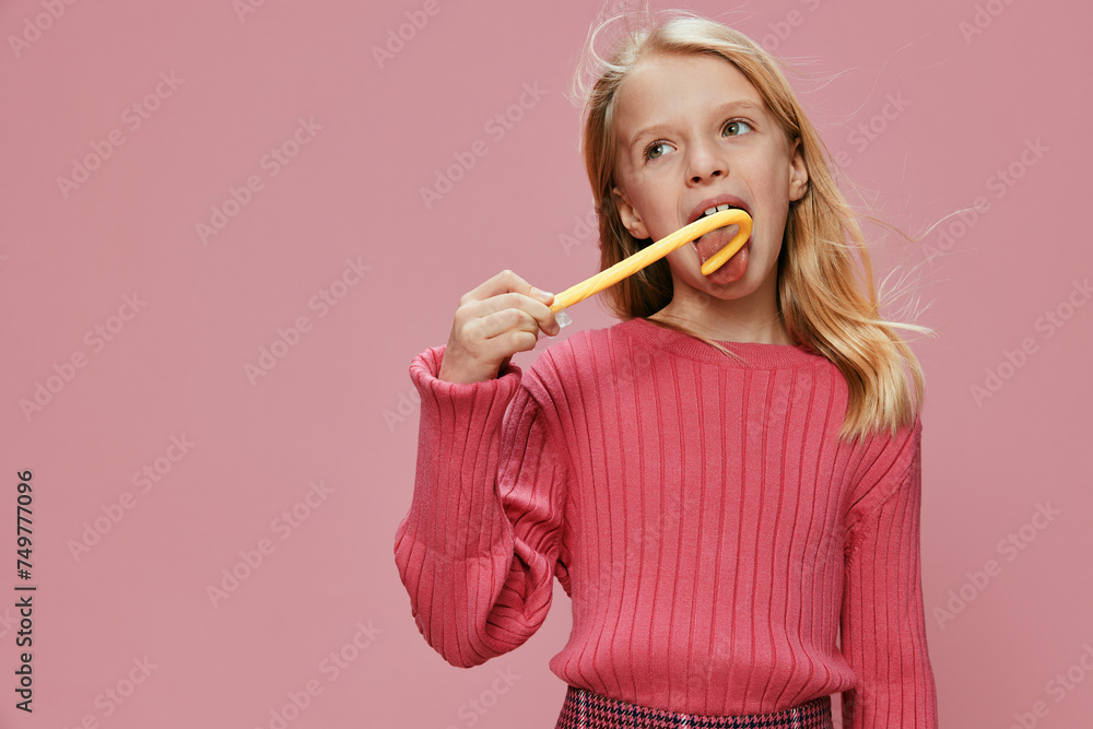 Happy Schoolgirl with a Stylish Pink Lollypop A beautiful, cute, and fashionable young girl with a big smile on her face, holding a pink lollypop in a studio set Expressing joy and excitement, she Happy Schoolgirl with a Stylish Pink Lollypop A beautiful, cute, and fashionable young girl with a big smile on her face, holding a pink lollypop in a studio set Expressing joy and excitement, she