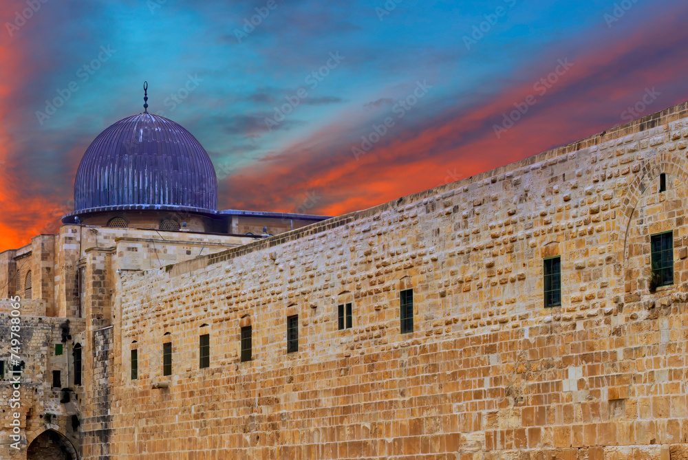 Dramatic sunrise above  ancient Al-Aqsa Mosque, the Mosque is  located in old city of Jerusalem and is the third holiest site of Islam in the Middle East