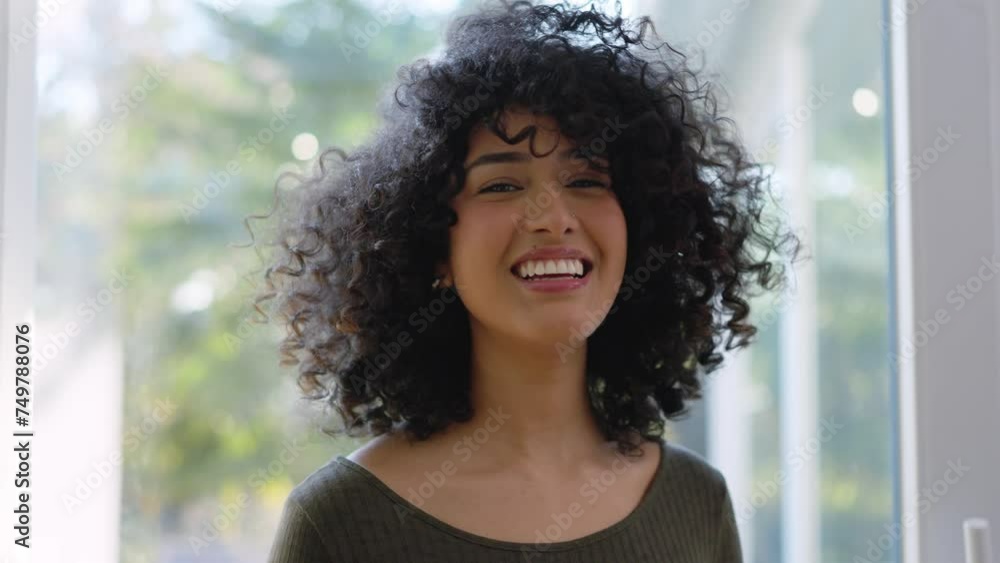 Beauty african woman with curly hair smiling at camera Beauty african woman with curly hair smiling at camera