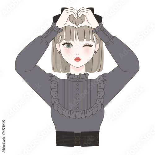 頭の上でハートを作る女の子