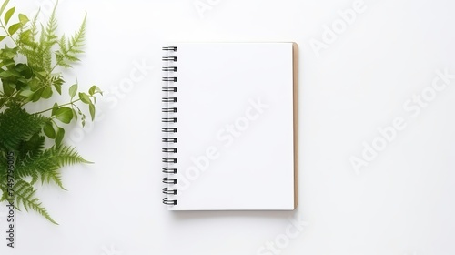 Business Concept - Top View of Spiral Blank Notebook on White Background Desk for Mockup.