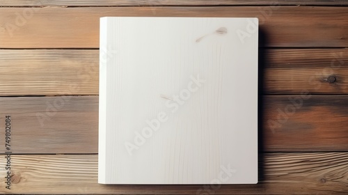 On a wooden backdrop, a blank catalog, magazines, and book mockup await, with empty note paper, all viewed from the top.