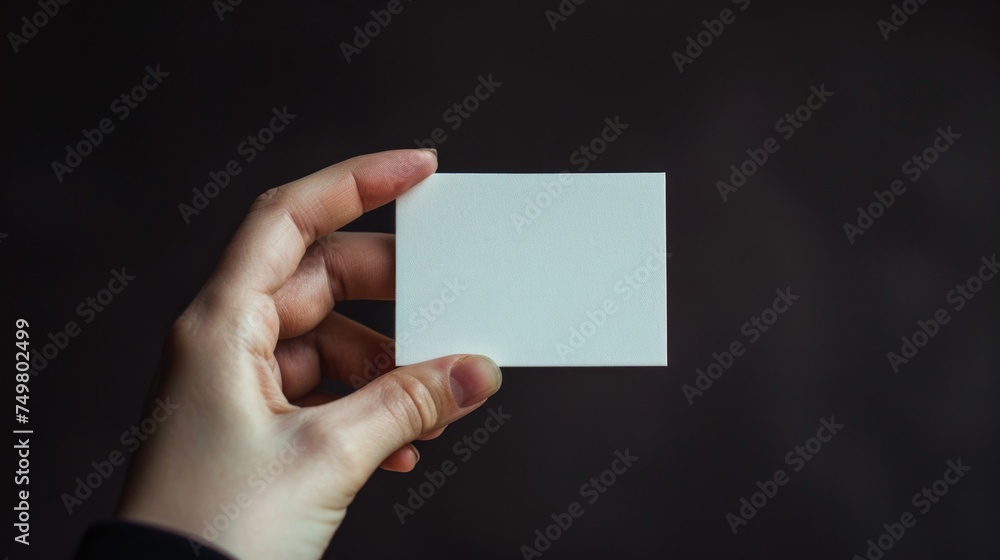 Person holding a white card, versatile image for various uses Person holding a white card, versatile image for various uses