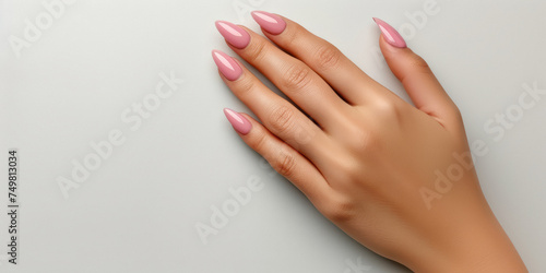 Female hand with pink nail design, Nail Polish. Art Manicure. Modern style pink Nail Design.