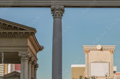 Neon signs, glitz casino hotel resorts, traffic and highrise city skyline in superlative gambling wedding party destination Las Vegas, Nevada with strip traffic street scene and modern architecture