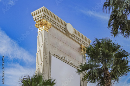 Neon signs, glitz casino hotel resorts, traffic and highrise city skyline in superlative gambling wedding party destination Las Vegas, Nevada with strip traffic street scene and modern architecture