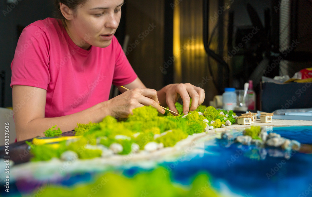 The process of making the art decor of epoxy resin, natural stones and moss