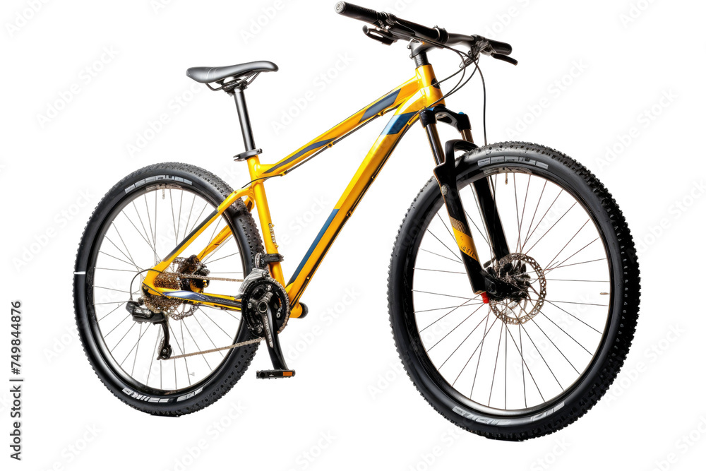 Yellow Mountain Bike. A bright yellow bike stand against a clean white background. The bikes frame tires handlebars and pedals are clearly visible showcasing its vibrant color and rugged design.