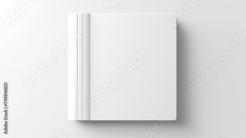 A realistic white book vector mockup showcases a top-down perspective, featuring a book lying on a surface with shadow, serving as a template for art, images, or text placement. photo