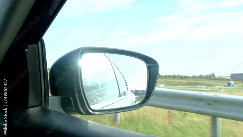 view of car rear mirror ride by speedway view of car rear mirror ride by speedway
