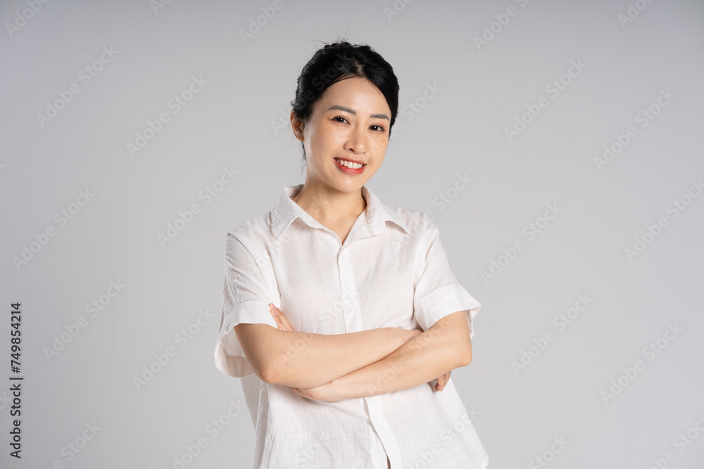 Portrait of beautiful asian woman posing on white background Portrait of beautiful asian woman posing on white background