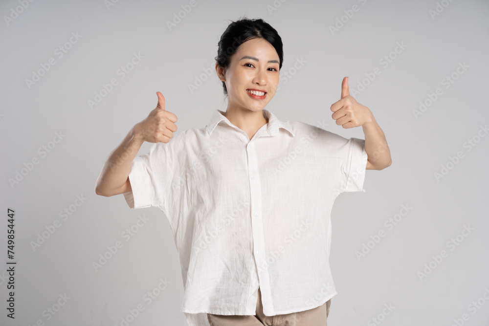Portrait of beautiful asian woman posing on white background Portrait of beautiful asian woman posing on white background