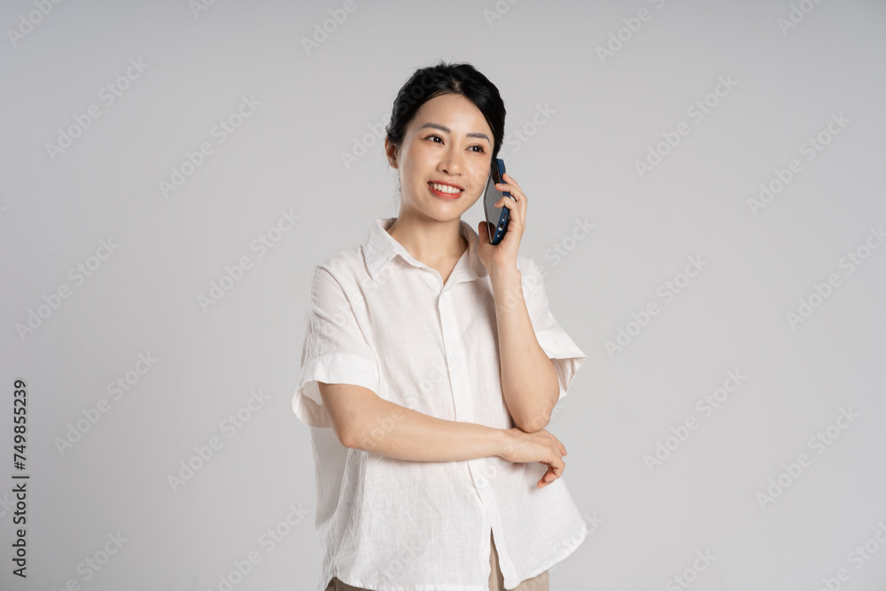 Portrait of beautiful asian woman posing on white background Portrait of beautiful asian woman posing on white background