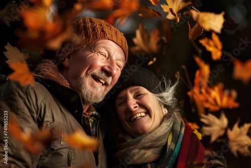 Portrait. A smiling elderly couple among the autumn leaves. Close-up. couple in autumn park © Vasilisa