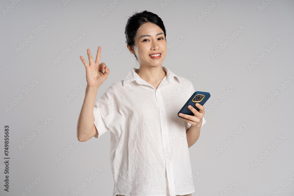 Portrait of beautiful asian woman posing on white background Portrait of beautiful asian woman posing on white background