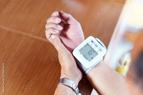 The wrist of a person whose blood pressure is measured with a blood pressure monitor. photo