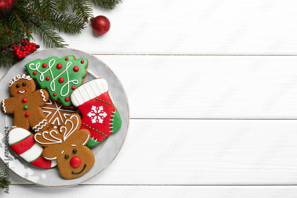 Tasty homemade Christmas cookies on white wooden table, top view. Space for text