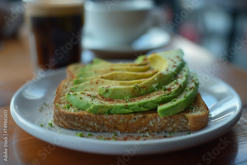 Healthy avocado toasts for breakfast or lunch with rye bread, sliced avocado, salt and pepper. Vegetarian sandwiches. Plant-based diet. Whole food concept.