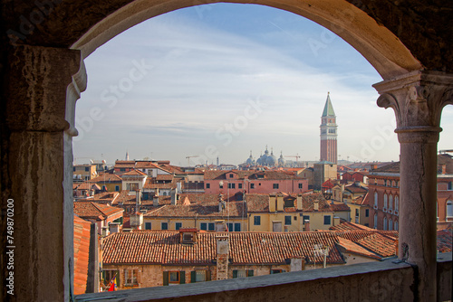 VENICE, ITALY, February 3, 2024 : View of the roofs and campanile from the top of the famous staircase of Palazzo Contarini del Bovolo