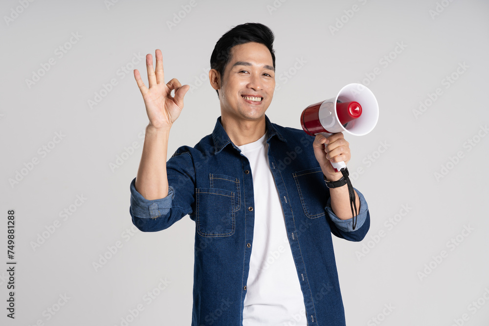 Portrait of Asian man posing on white background Portrait of Asian man posing on white background