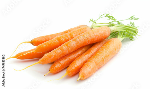 Fresh carrots with green tops on a white background. Studio food photography for design and print