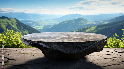 Outdoor stone table with mountains as background Used to display various products Related to an outdoor theme or related to nature. © sema_srinouljan