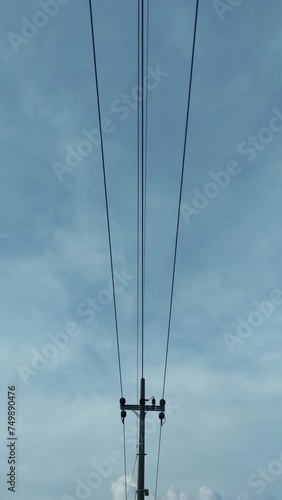 Industrial background of electricity pole with blue sky as the background