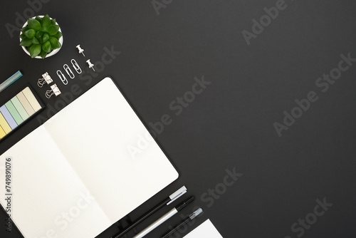 Banner with black, white and gray school and office stationery and note on black background. Flatly, copyspace.