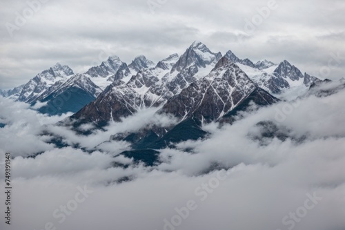 Wallpaper Mural Majestic mountains capped with snow rise above swirling clouds in serene atmosphere  Torontodigital.ca