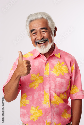 An elderly handsome man showing a thumbs up gesture photo