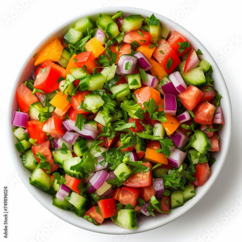 Israeli salad with cucumbers, tomatoes, red onions, bell peppers, and parsley in a white bowl. Studio food photography for culinary and recipe design.