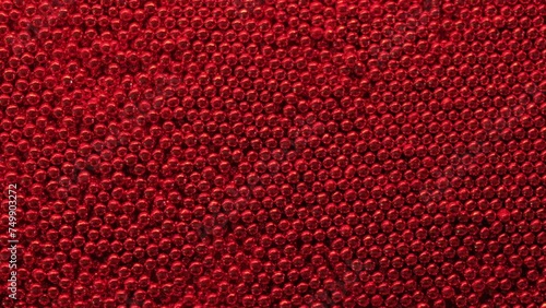 Red metal balls texture close-up. photo