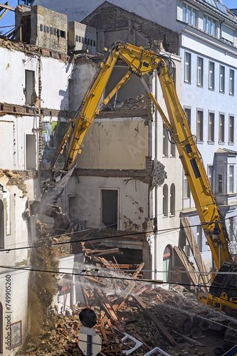 A bulldozer is demolishing an old building in Vienna
