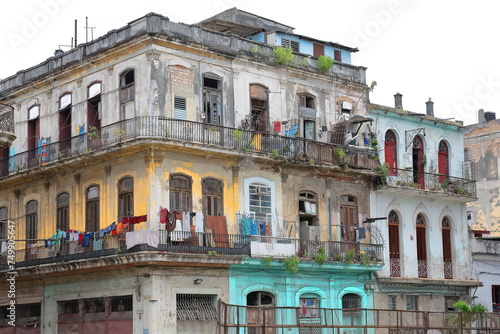 Tenement house on the Villegas and Lamparilla streets corner  Old Havana  with cast-iron railing balconies and drying laundry. La Habana-Cuba-039