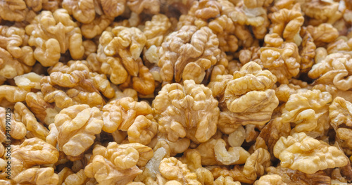 Close up photo of natural dried walnuts, selective focus, food background.
