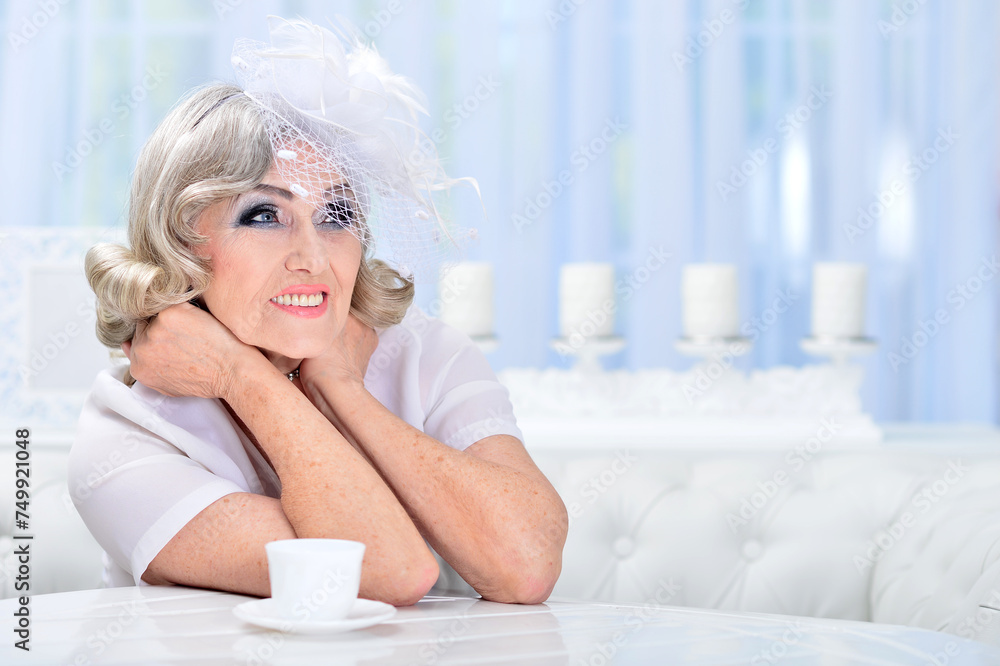 Portrait of a beautiful senior woman drinking coffee Portrait of a beautiful senior woman drinking coffee