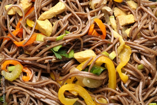 Stir-fry. Tasty noodles with vegetables and meat as background, closeup