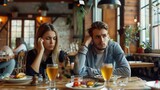 Young guy feeling bored on dull date at restaurant, disappointed in his partner. Millennial couple having disagreement, cannot find common grounds. Relationship problem concept