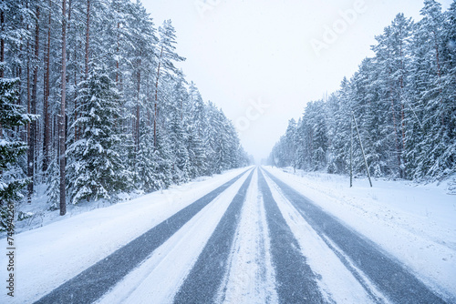 Winter road in the forest. Winter landscape with snow covered trees.