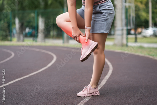 Fotografia Achilles tendon injury, callus on the heel while running, foot pain, woman suffe