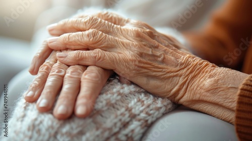 A close-up of a supportive hand holding onto an elderly hand showing signs of arthritis, with a focus on a comforting gesture, set against a soft, compassionate background