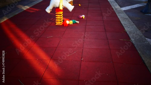 crime scene in a children's playground, where a child was kidnapped. the police present to catalog the evidence. swing and games seized.