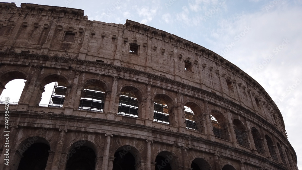 Obraz premium Superposed order of the Colosseum in Rome, Italy. The ancient Roman Colosseum is one of the main tourist attractions in Europe.